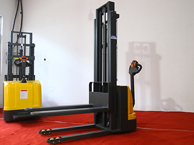 Electro-hydraulic forkleg stacker